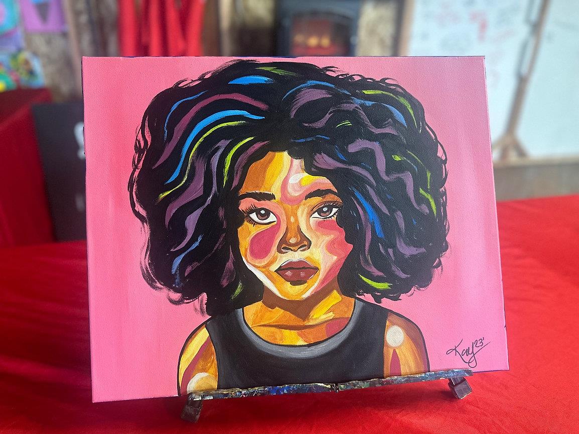 Colorful straight-ahead portrait of black woman with bright pink background. Resembles a young Oprah Winfrey.
