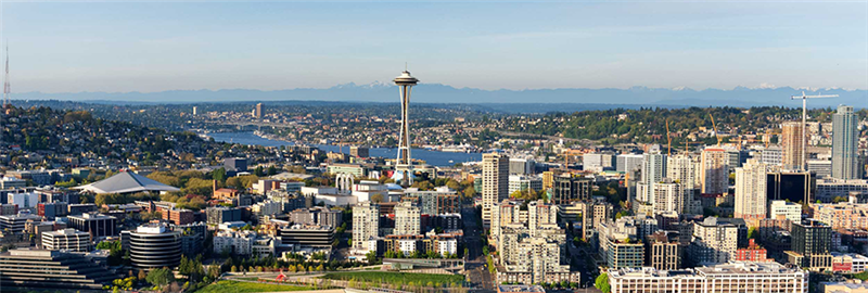 Seattle skyline showing Seattle Center and the Space Needle on a sunny day.