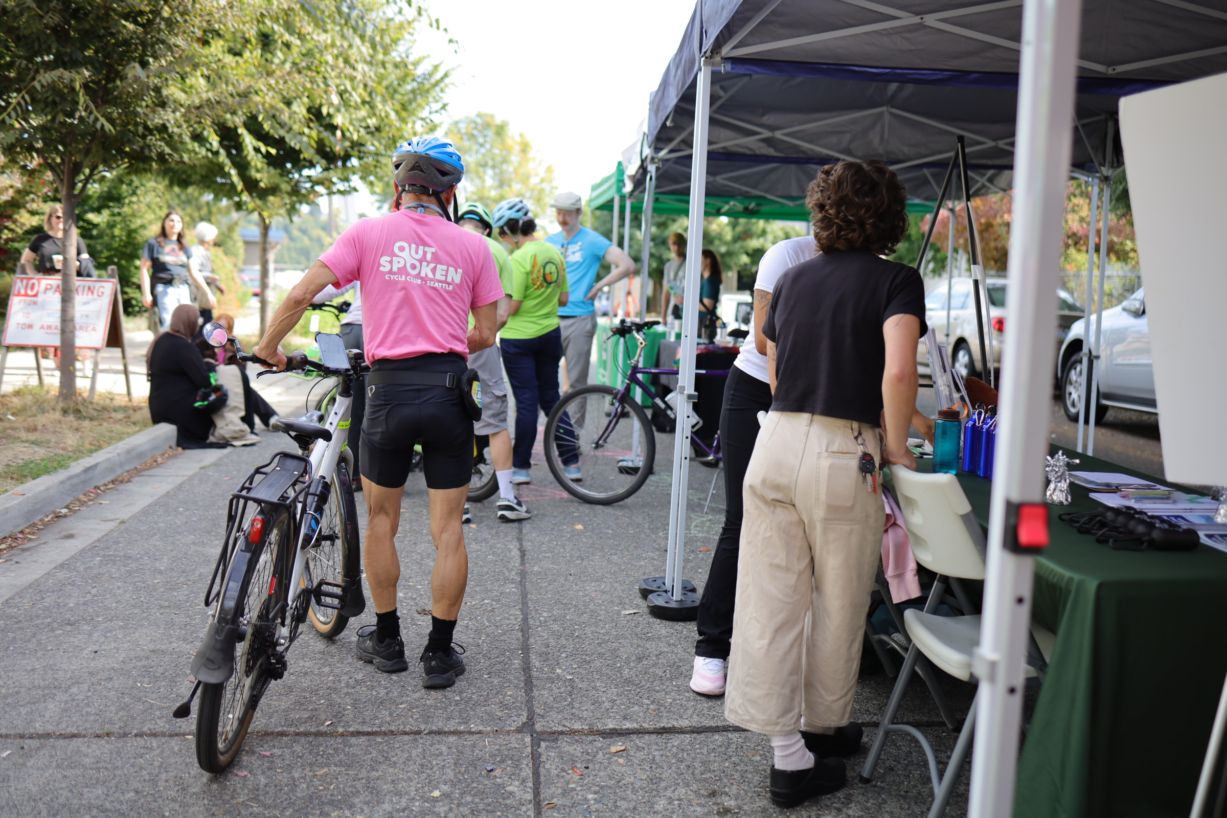 Cyclists gathered around info booths for South Park community organizations.