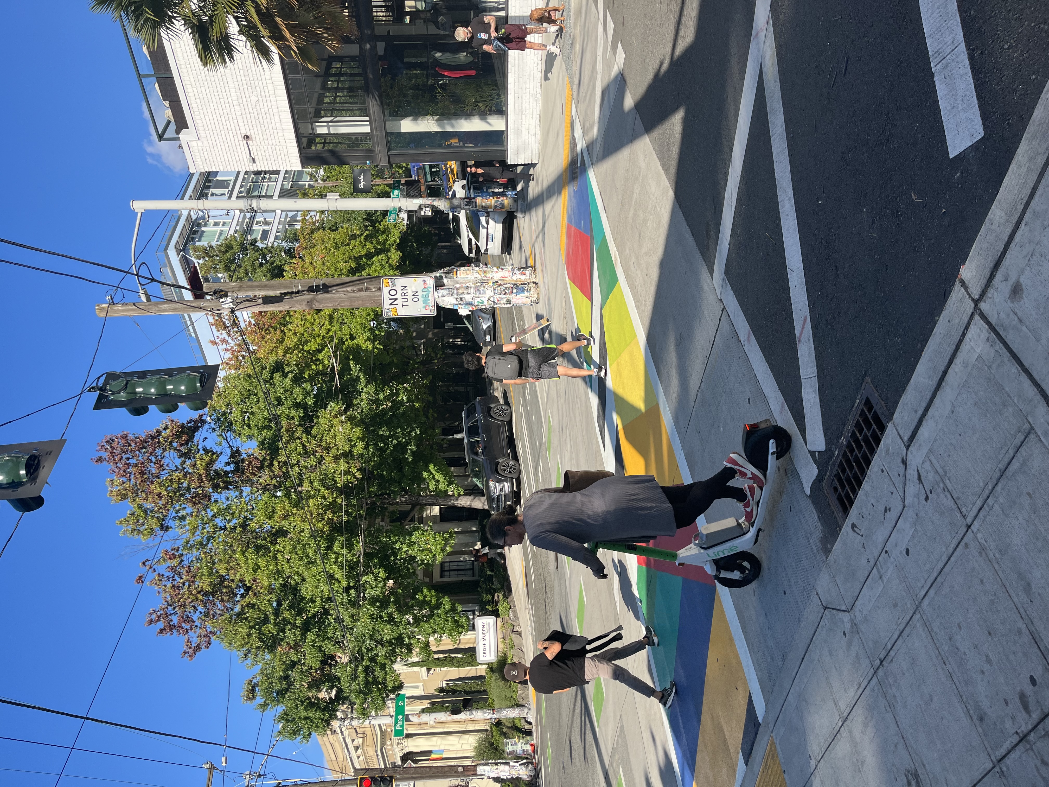 People walking on the E Pine St Crosswalk