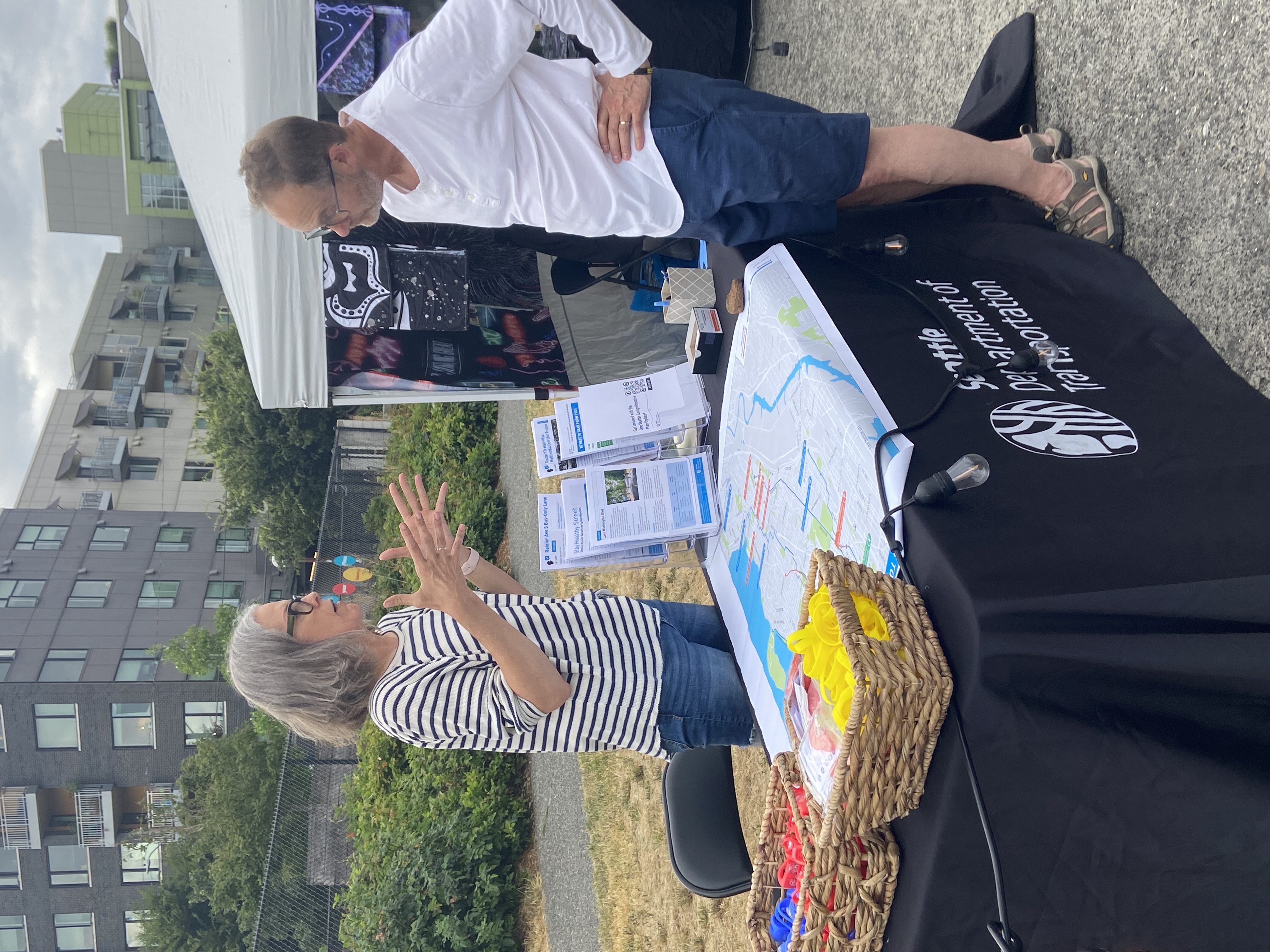 Photo showing SDOT staffing a booth for outreach and engagement in South Seattle.