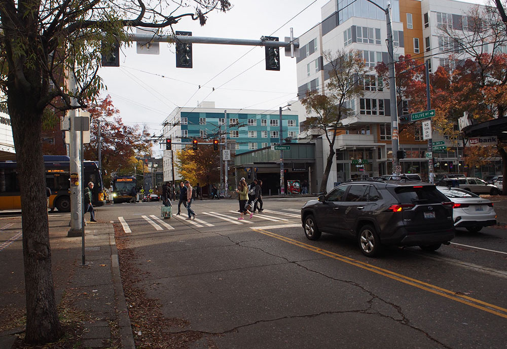 New westbound bus only left turn lane and turn restrictions on E John St and Broadway 