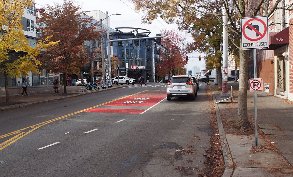 New westbound bus only left turn lane and turn restrictions on E John St and Broadway 