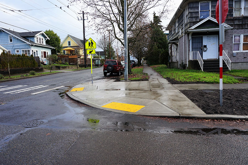 Concrete bulb and new sidewalk at 21st Ave E and E John Street.