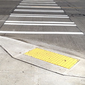 Example of a curb ramp leading to a sidewalk.