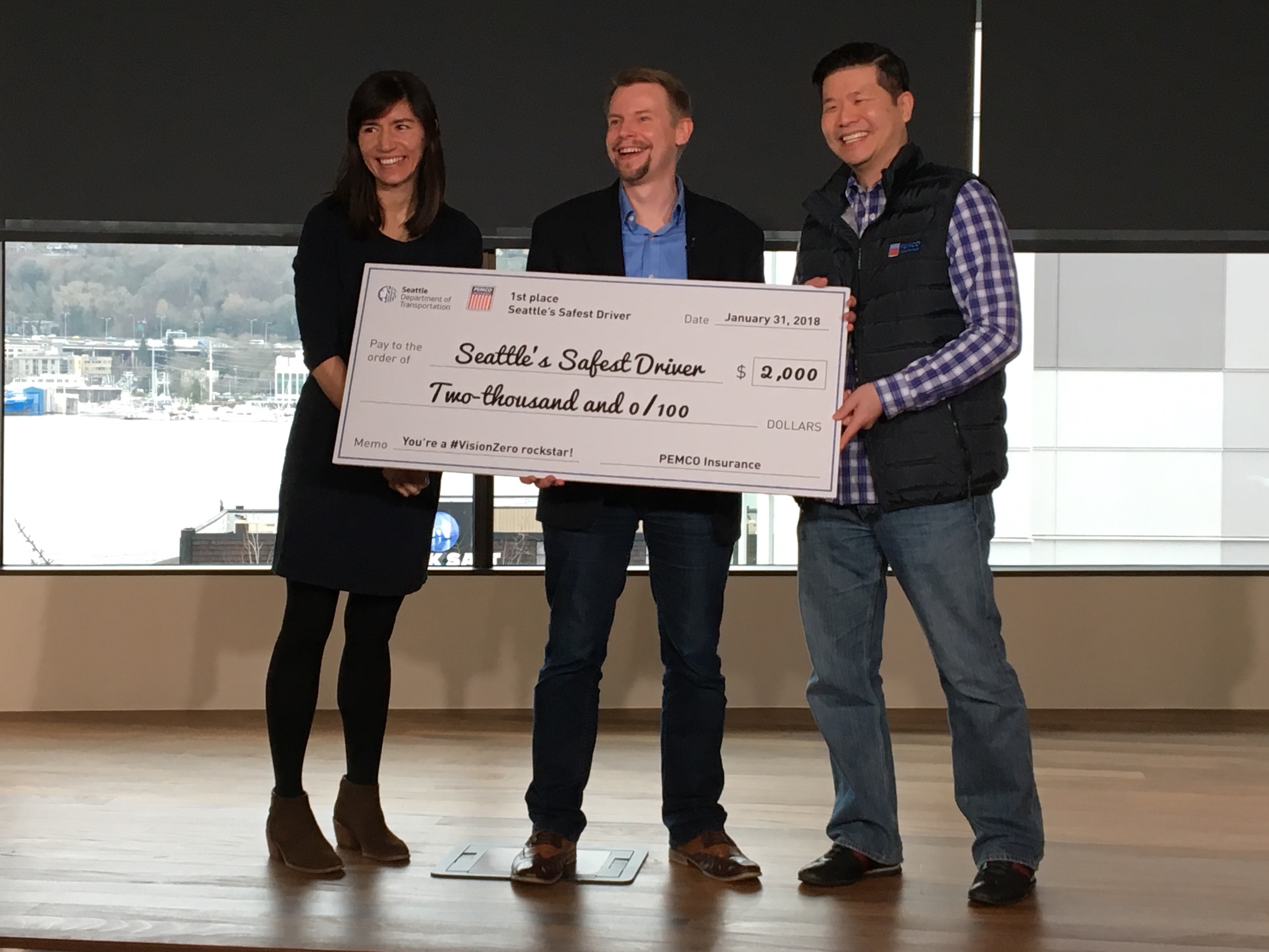 SDOT and PEMCO hand off a giant check to Russell Lebert, Seattle&rsquo;s Safest Driver