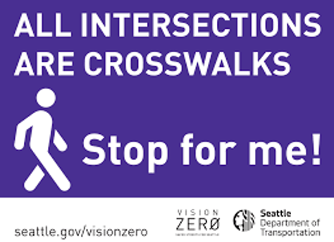 Picture of a yard sign with a pedestrian icon which states, "All intersections are crosswalks. Stop for me!"
