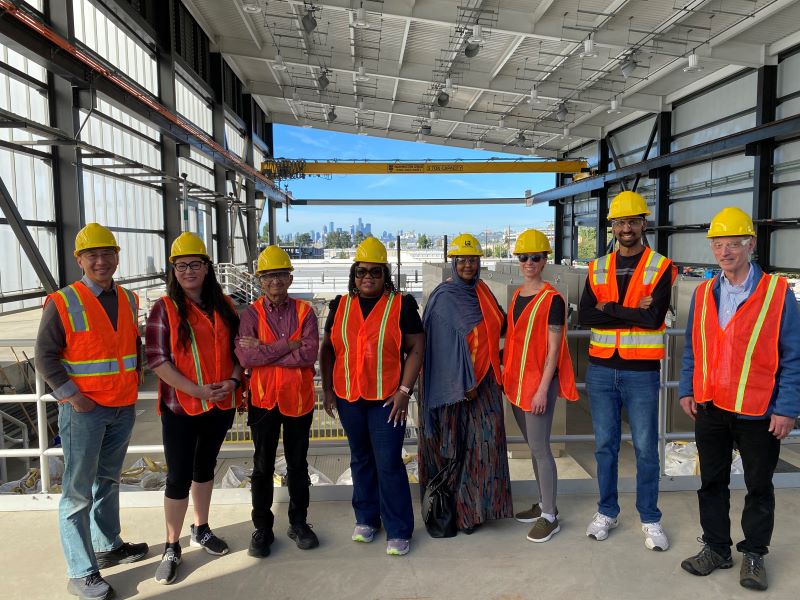 GM Andrew Lee and the Customer Review Panel in vests and hard hats on tour at a SPU facility.