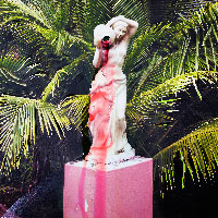 A statue of a woman pouring water out of a vessel. The liquid coming out is bright pink, staining her and the pedestal all the way down.