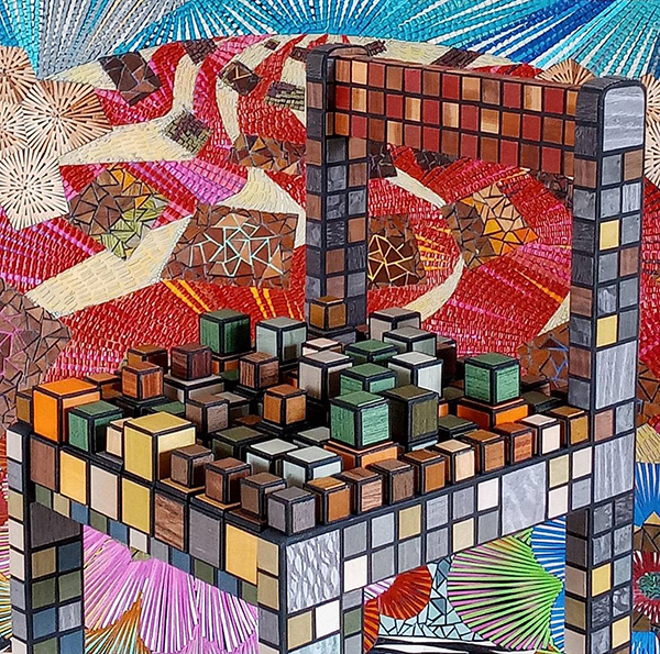 A colorful wooden chair made of colorful cubes in front of a mosaic background.