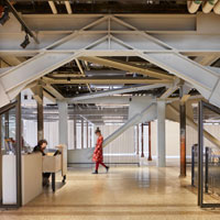 Steel structural beams exposed in a clean office space.