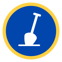 A circular sign with a blue background and yellow border featuring a white silhouette of a shovel.