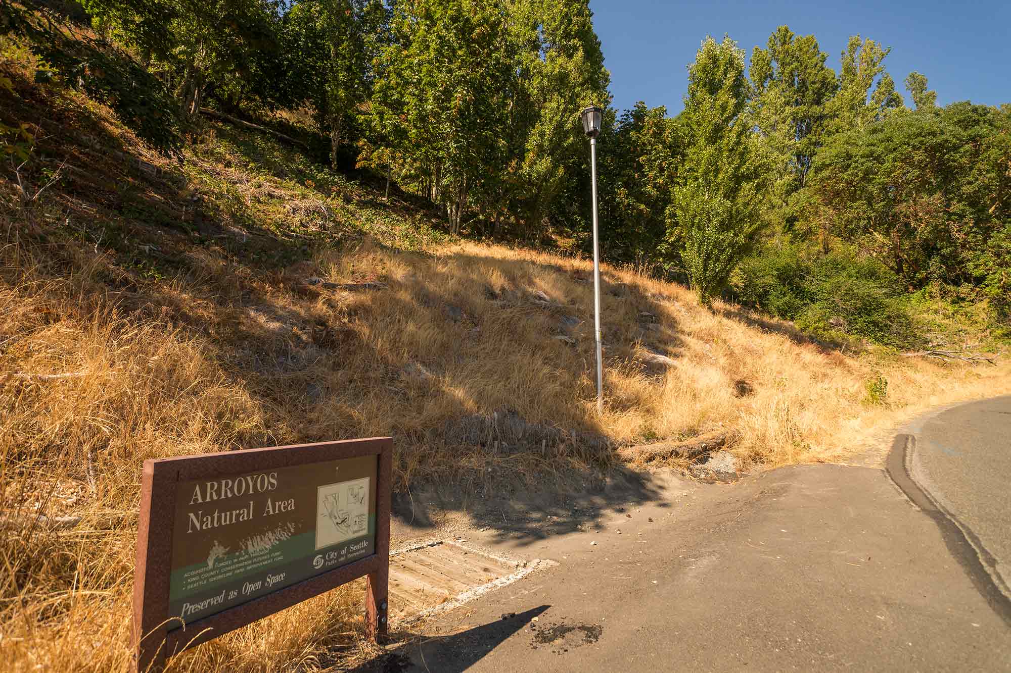 Arroyos Natural Area hillside with sign- Photo by TIA International Photography