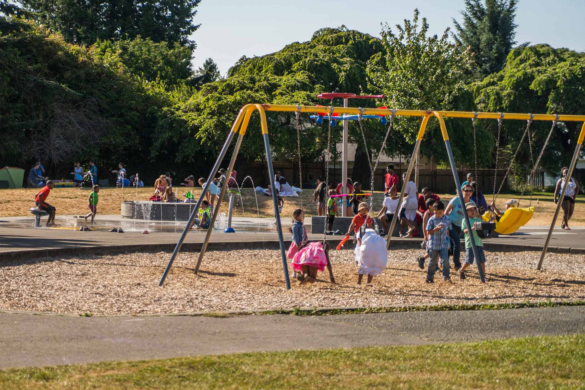 Highland Park Playground children on swingsets - Photo by TIA International Photography