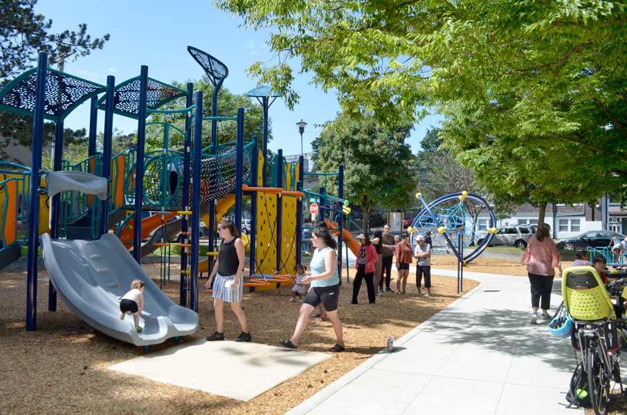 Playscape with people - Families and children playing in play area