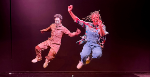 Two teens dance in rehearsal for Teen Summer Musical