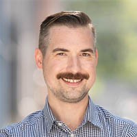 Photo of Drue Nyenhuis, smiling and standing outside