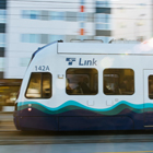Link light rail moving quickly against the background