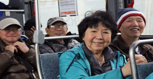 A group of seniors on a public bus