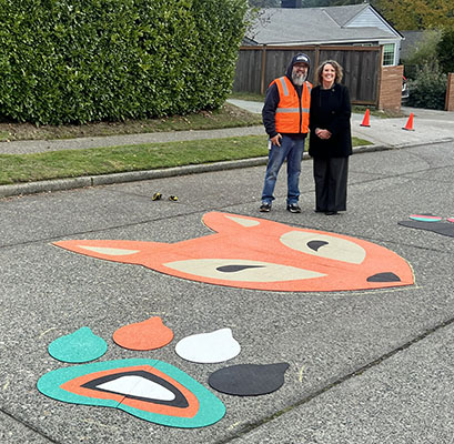 Liz Dunn with SDOT Crew Chief after school street art was installed
