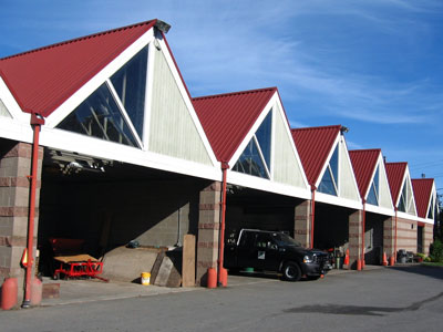 Rainfall drains off the roof into downspouts on the building and then into nearby catch basins or into the property's stormwater structures.