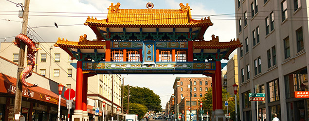 Street in Seattle's International District with a paifang (traditional Chinese archway)