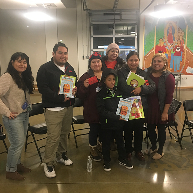 Former Outreach and Training Specialist (left), Tey Thach, and Community Safety Ambassador, Angelie Mendoza (far right) working wtih residents from Plaza Roberto Maestas on individual preparedness.